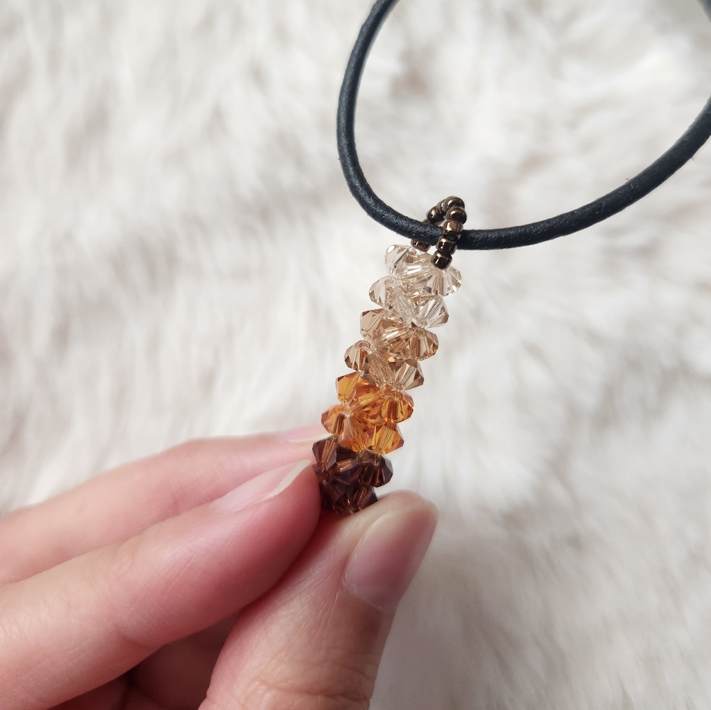 Hamdmade brown orange and tan beaded charm necklace
